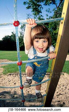 Climbing on play structure View Large Photo Image Stock Photograph - Climbing on play structure. Fotosearch