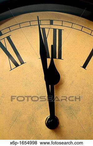 Stock Photo - Clock about to strike Midnight. Fotosearch