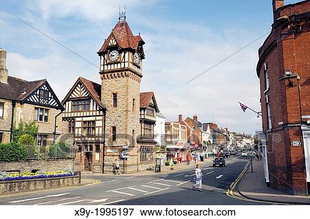 Stock Photo - Clock Tower and library on the High Street in the town of Ledbury, Herefordshire, England.. Fotosearch