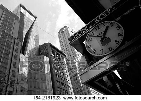 Stock Image - Clock with Hong Kong Time in New York. Fotosearch