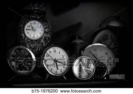 clocks and alarm clocks on a shelf View Large Photo Image Stock Image - clocks and alarm clocks on a shelf. Fotosearch