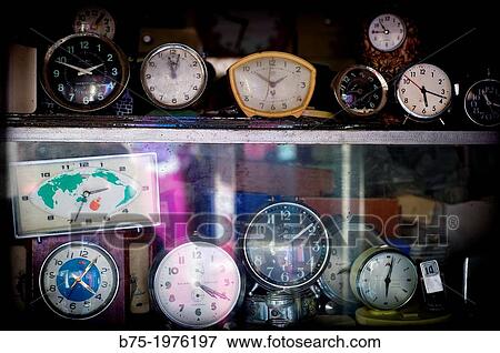 clocks and alarm clocks on a shelf View Large Photo Image Stock Photo - clocks and alarm clocks on a shelf. Fotosearch