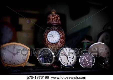 clocks and alarm clocks on a shelf View Large Photo Image Stock Photo - clocks and alarm clocks on a shelf. Fotosearch