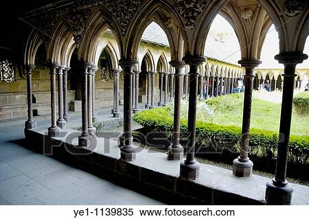 Stock Photography - Cloisters and courtyard garden at Mont Saint-Michel, a fortified medieval monastery on an island in Normandy, France.. Fotosearch