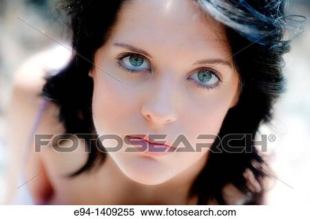 Close head shot portrait of a nineteen year old brunette woman looking directly at the camera. View Large Photo Image Stock Photography - Close head shot portrait of a nineteen year old brunette woman looking directly at the camera.. Fotosearch