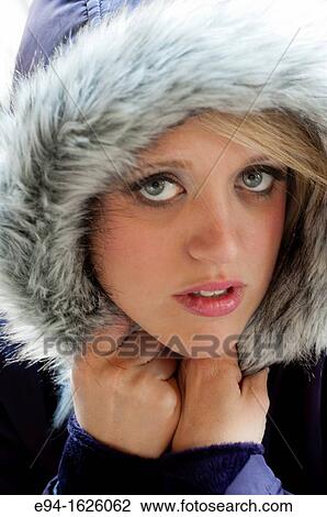 Close in shot of a 31 year old blond woman with a serious expression, eyes to camera wearing a hooded coat View Large Photo Image Stock Image - Close in shot of a 31 year old blond woman with a serious expression, eyes to camera wearing a hooded coat. Fotosearch