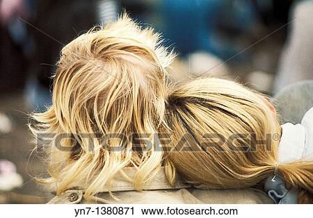 close up back view of a a blond couple with the girl's head on the boy's shoulder View Large Photo Image Stock Image - close up back view of a a blond couple with the girl's head on the boy's shoulder. Fotosearch