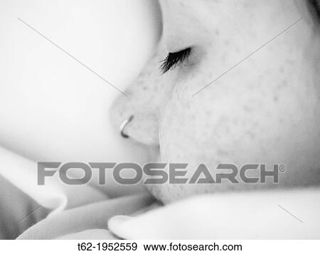 Stock Photo - Close-up face of a sleeping teenager. White and Black.. Fotosearch