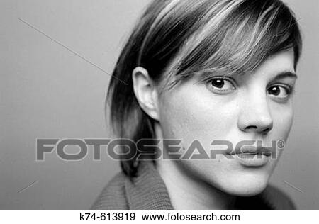 close up image of young woman gazing at viewer View Large Photo Image Stock Photo - close up image of young woman gazing at viewer. Fotosearch
