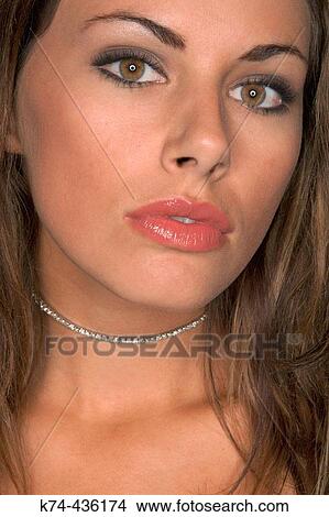 Close-up image of young woman's face View Large Photo Image Picture - Close-up image of young woman's face. Fotosearch