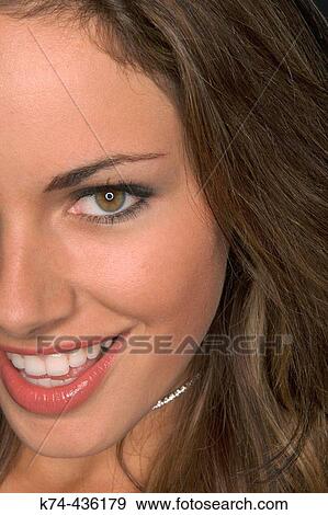 Close-up image of young woman's face View Large Photo Image Stock Photo - Close-up image of young woman's face. Fotosearch