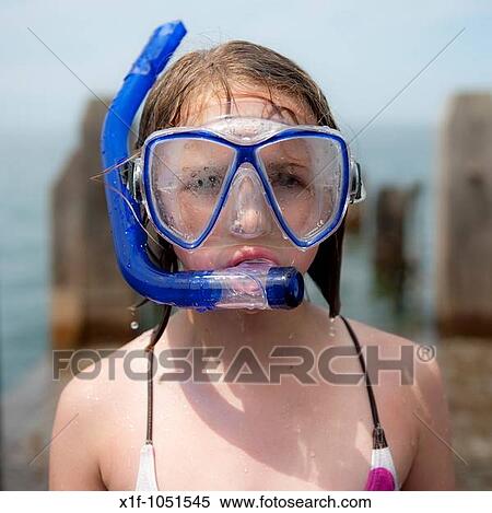 Close up of a 10 year old girl wearing a diving mask and snorkel after being in the water, UK View Large Photo Image Stock Photography - Close up of a 10 year old girl wearing a diving mask and snorkel after being in the water, UK. Fotosearch