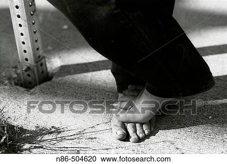 Close-up of a bare man's feet View Large Photo Image Stock Image - Close-up of a bare man's feet. Fotosearch