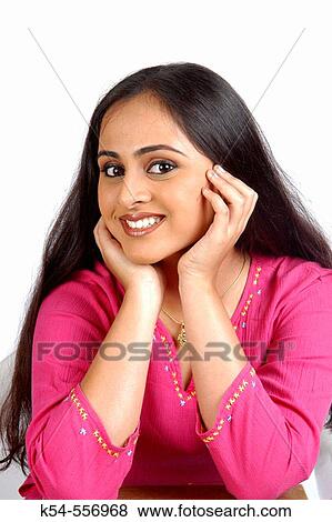 Stock Photo - Close up of a beautiful, young smiling lady, in pink top.. Fotosearch