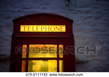 Close up of a British phone box, illuminated at night. England, UK, Europe. View Large Photo Image Stock Image - Close up of a British phone box, illuminated at night. England, UK, Europe.. Fotosearch