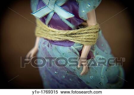 Close-up of a female doll tied-up View Large Photo Image Stock Photography - Close-up of a female doll tied-up. Fotosearch