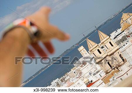 Close-up of a human hand pointing to a church of San Antonio Cadiz Andalusia Spain View Large Photo Image Stock Photo - Close-up of a human hand pointing to a church of San Antonio Cadiz Andalusia Spain. Fotosearch