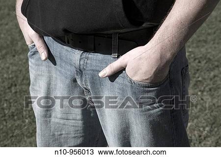Close-up of a man with hands in his pockets View Large Photo Image Stock Image - Close-up of a man with hands in his pockets. Fotosearch