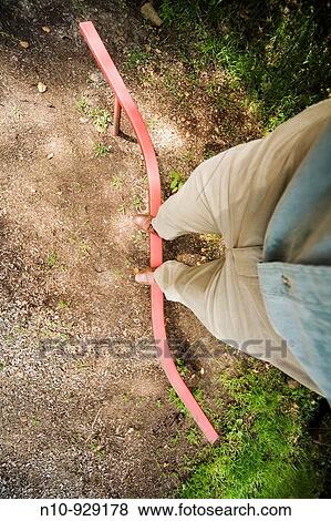 Close-up of a man's feet on a child's balance beam View Large Photo Image Stock Photo - Close-up of a man's feet on a child's balance beam. Fotosearch