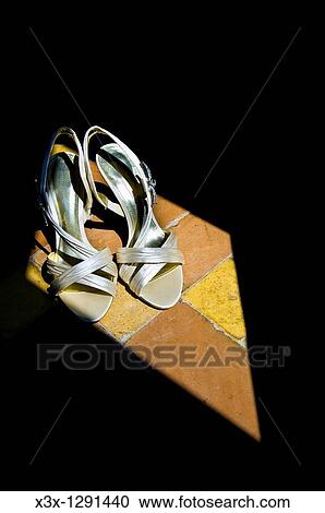 Stock Image - Close-up of a pair of shoes. Fotosearch