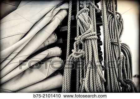Close-up of a piece of stick boom and mainsail and ropes of a classic sailboat, moored at Port Mahon, Menorca, Balearic Islands, Spain. View Large Photo Image Stock Image - Close-up of a piece of stick boom and mainsail and ropes of a classic sailboat, moored at Port Mahon, Menorca, Balearic Islands, Spain.. Fotosearch