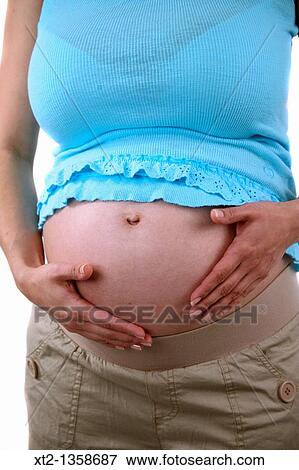 close up of a pregnant woman, isolated on white background View Large Photo Image Stock Photo - close up of a pregnant woman, isolated on white background. Fotosearch