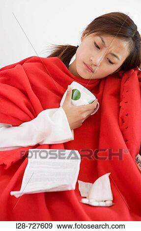 Close-up of a pregnant young woman reading a medical report View Large Photo Image Stock Photo - Close-up of a pregnant young woman reading a medical report. Fotosearch
