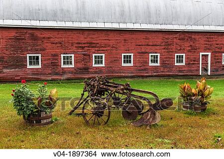 Close up of a red barn and a historic plough in North Randolph, Vermont, USA View Large Photo Image Picture - Close up of a red barn and a historic plough in North Randolph, Vermont, USA. Fotosearch