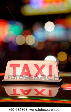 Close up of a taxi sign on the roof of taxis, standing in a row in the amusement center of Wanchai, Hong Kong Island, Hong Kong, China, East Asia View Large Photo Image Stock Photo - Close up of a taxi sign on the roof of taxis, standing in a row in the amusement center of Wanchai, Hong Kong Island, Hong Kong, China, East Asia. Fotosearch