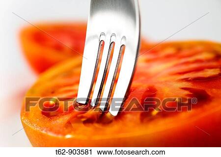 Close-up of a tomato and a fork Still Life Color View Large Photo Image Stock Image - Close-up of a tomato and a fork Still Life Color. Fotosearch