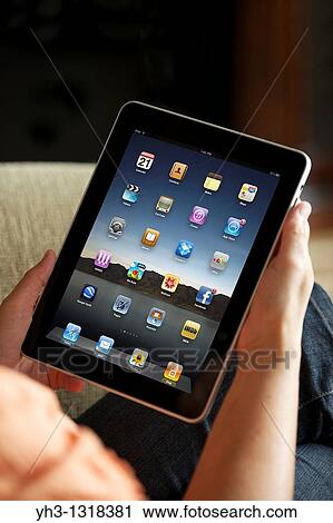 Close up of a woman handholding an iPad View Large Photo Image Stock Image - Close up of a woman handholding an iPad. Fotosearch