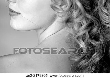 Close-up of a woman in black and white with bare shoulder, neck, lower face and long curly hair View Large Photo Image Stock Photography - Close-up of a woman in black and white with bare shoulder, neck, lower face and long curly hair. Fotosearch