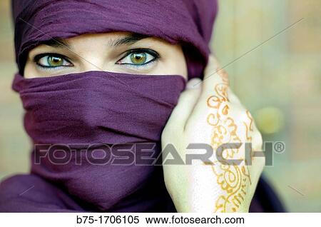 Close up of a woman portrait with hands tatto in moroccan henna and hijab View Large Photo Image Stock Photography - Close up of a woman portrait with hands tatto in moroccan henna and hijab. Fotosearch