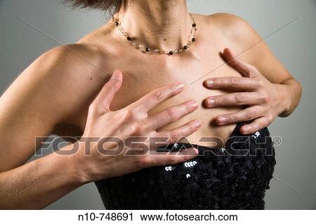 Close-up of a woman wearing an evening gown. View Large Photo Image Stock Image - Close-up of a woman wearing an evening gown.. Fotosearch