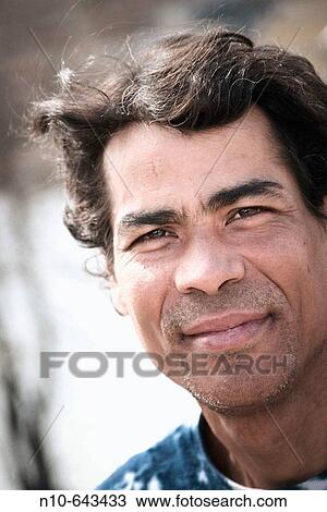 Close-up of a young Hispanic man posing. View Large Photo Image Stock Image - Close-up of a young Hispanic man posing.. Fotosearch