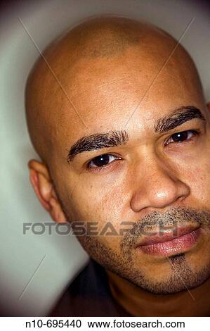 Close-up of a young Hispanic man posing. View Large Photo Image Stock Image - Close-up of a young Hispanic man posing.. Fotosearch