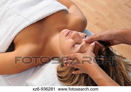 Close-up of a Young woman receiving face massage View Large Photo Image Stock Image - Close-up of a Young woman receiving face massage. Fotosearch