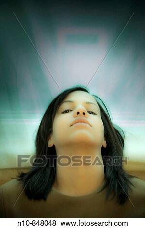 Stock Photo - Close-up of a young woman. Fotosearch