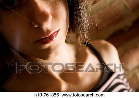 Close-up of a young woman View Large Photo Image Stock Photograph - Close-up of a young woman. Fotosearch
