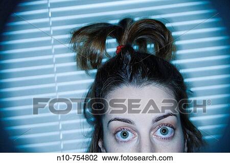 Close-up of a young woman whose hair is tied with an elastic band. View Large Photo Image Stock Image - Close-up of a young woman whose hair is tied with an elastic band.. Fotosearch