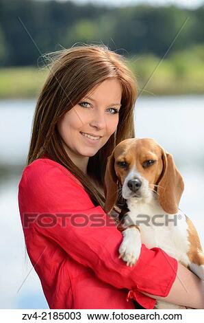 Close-up of a young woman with her Beagle dog in spring. View Large Photo Image Stock Image - Close-up of a young woman with her Beagle dog in spring.. Fotosearch
