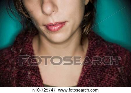 Close-up of a young woman's face View Large Photo Image Stock Photo - Close-up of a young woman's face. Fotosearch