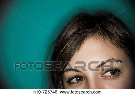 Close-up of a young woman's face View Large Photo Image Stock Photograph - Close-up of a young woman's face. Fotosearch