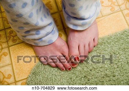 Close-up of a young woman's feet, with nail polish on her toenails. View Large Photo Image Stock Photo - Close-up of a young woman's feet, with nail polish on her toenails.. Fotosearch