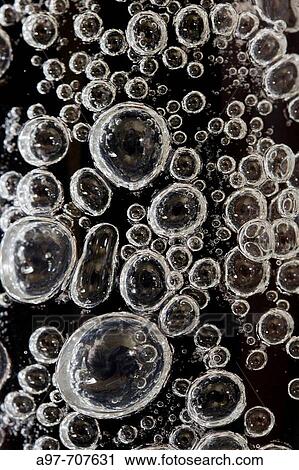 Close-up of air bubbles in glass vase. View Large Photo Image Stock Image - Close-up of air bubbles in glass vase.. Fotosearch