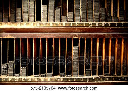 Picture - Close up of an old printer cabinet with diferent numbers written down. Fotosearch