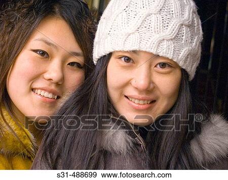 Close up of Asian sisters. View Large Photo Image Stock Photo - Close up of Asian sisters.. Fotosearch