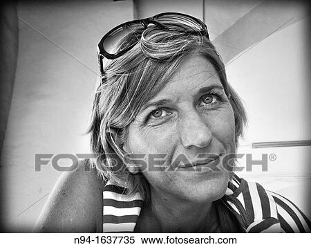Close up of blond woman with sunglasses on her head. View Large Photo Image Stock Photography - Close up of blond woman with sunglasses on her head.. Fotosearch