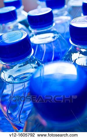 Close-up of bottles of water View Large Photo Image Stock Image - Close-up of bottles of water. Fotosearch