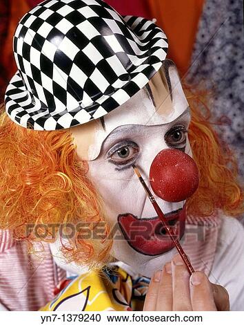 close up of clown putting the finishing touches to his make-up View Large Photo Image Stock Image - close up of clown putting the finishing touches to his make-up. Fotosearch